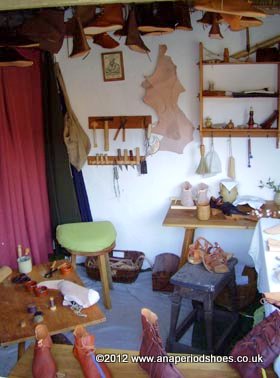  a fully equipped medieval shoe maker’s workshop with tools